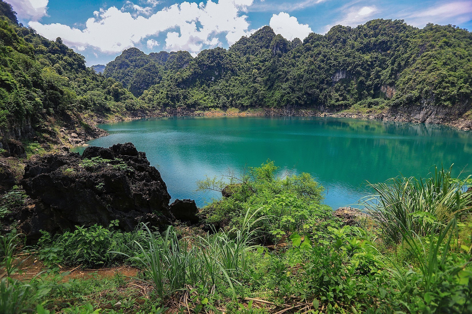 Mat Ngoc Lake is nestled in a limestone valley (Source: Collected) Mat Ngoc Lake is nestled in a limestone valley (Source: Collected)