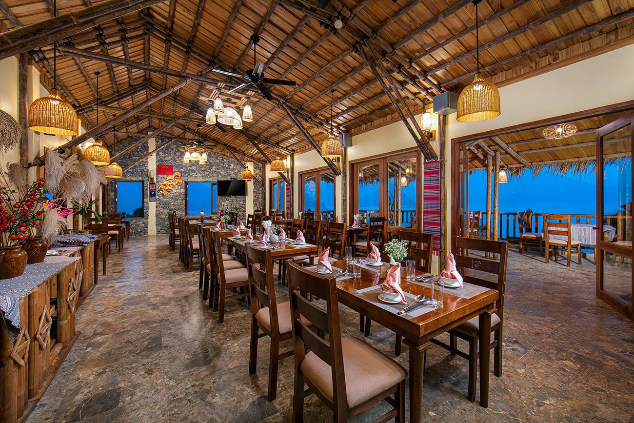 Bamboo Restaurant reception with a twisted bamboo staircase at Mai Chau Hideaway Bamboo Restaurant reception with a twisted bamboo staircase at Mai Chau Hideaway
