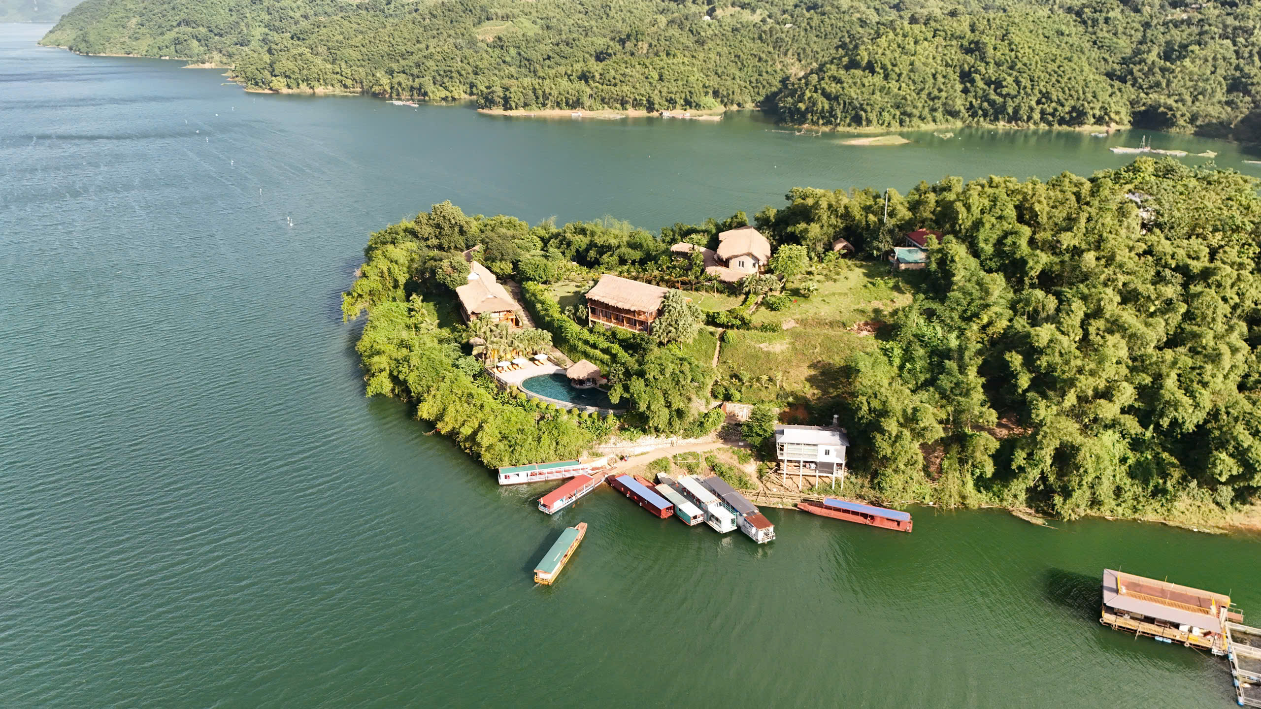A panoramic view of the tranquil Mai Chau Hideaway Lake Resort beside Hoa Binh Lake A panoramic view of the tranquil Mai Chau Hideaway Lake Resort beside Hoa Binh Lake