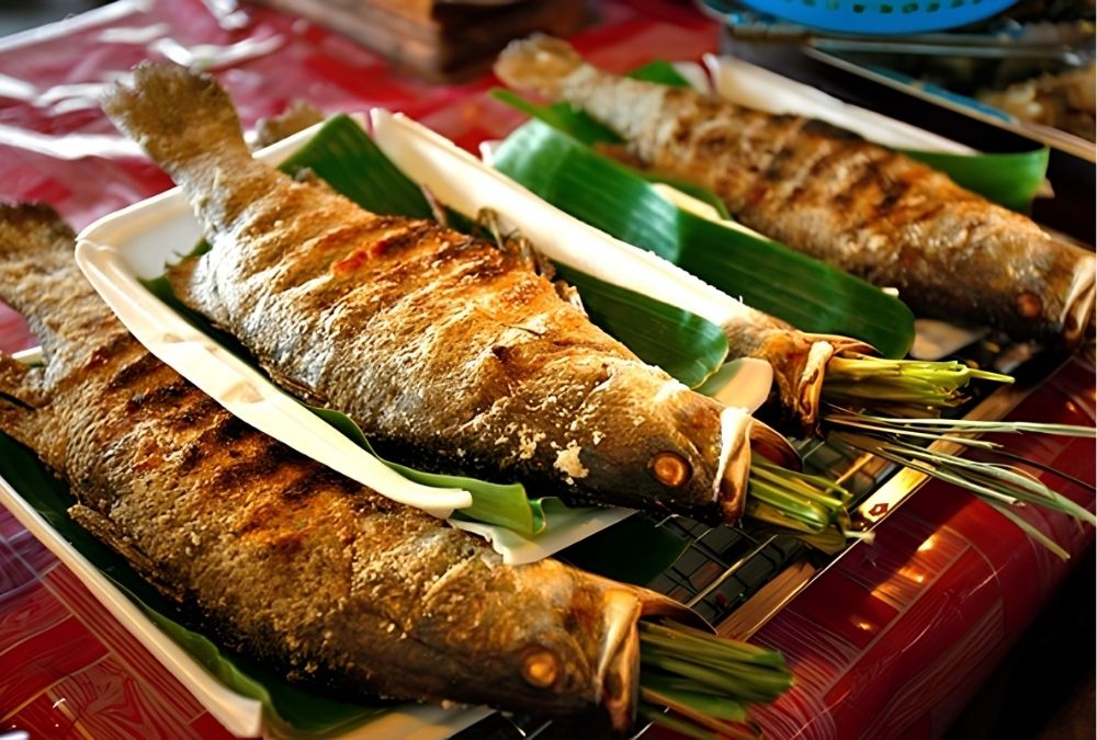 Cá nướng pa pỉnh tộp (Nguồn: Báo Văn Hoá) Cá nướng pa pỉnh tộp (Nguồn: Báo Văn Hoá)
